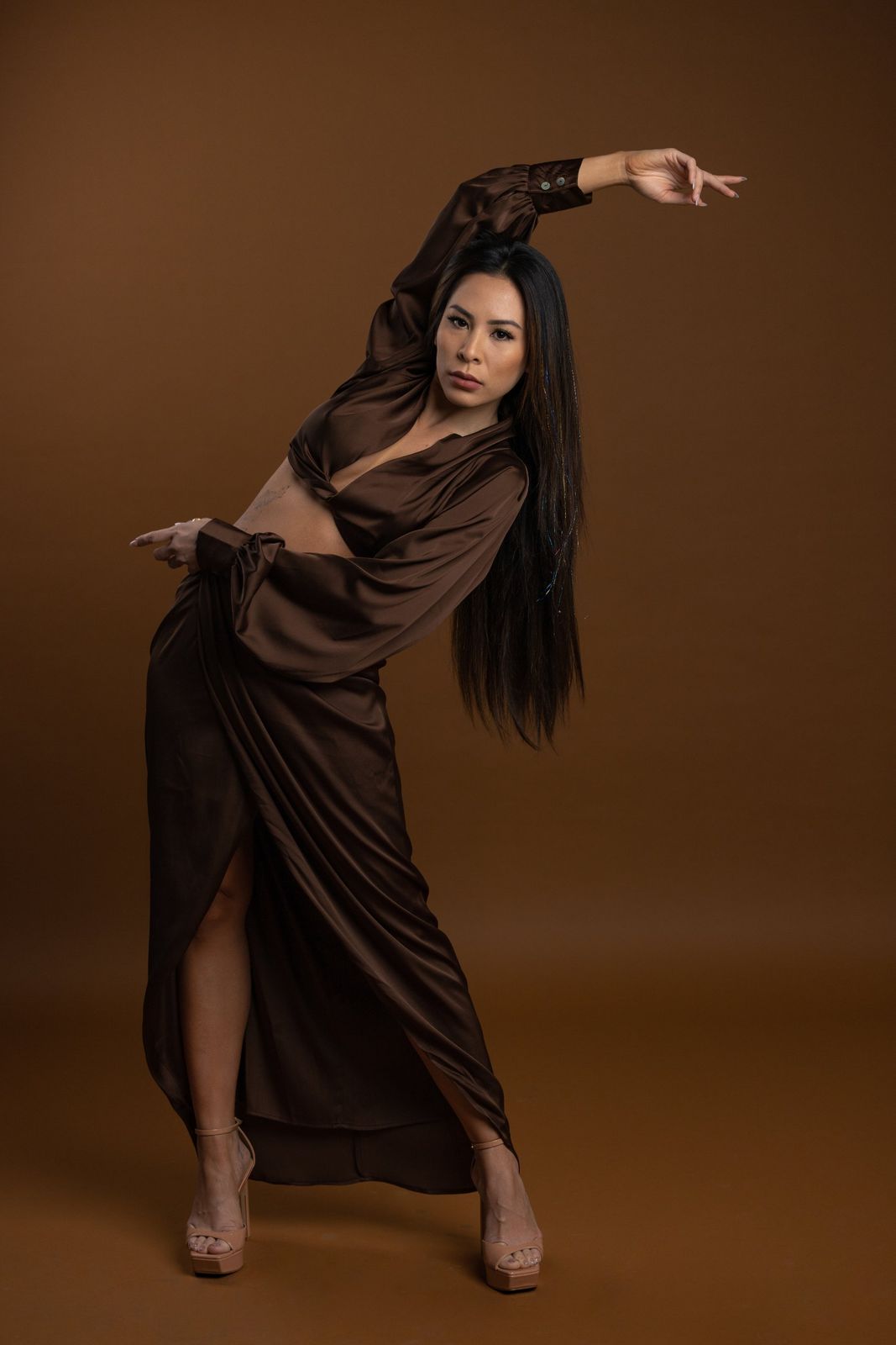 Editorial portrait in a brown satin dress