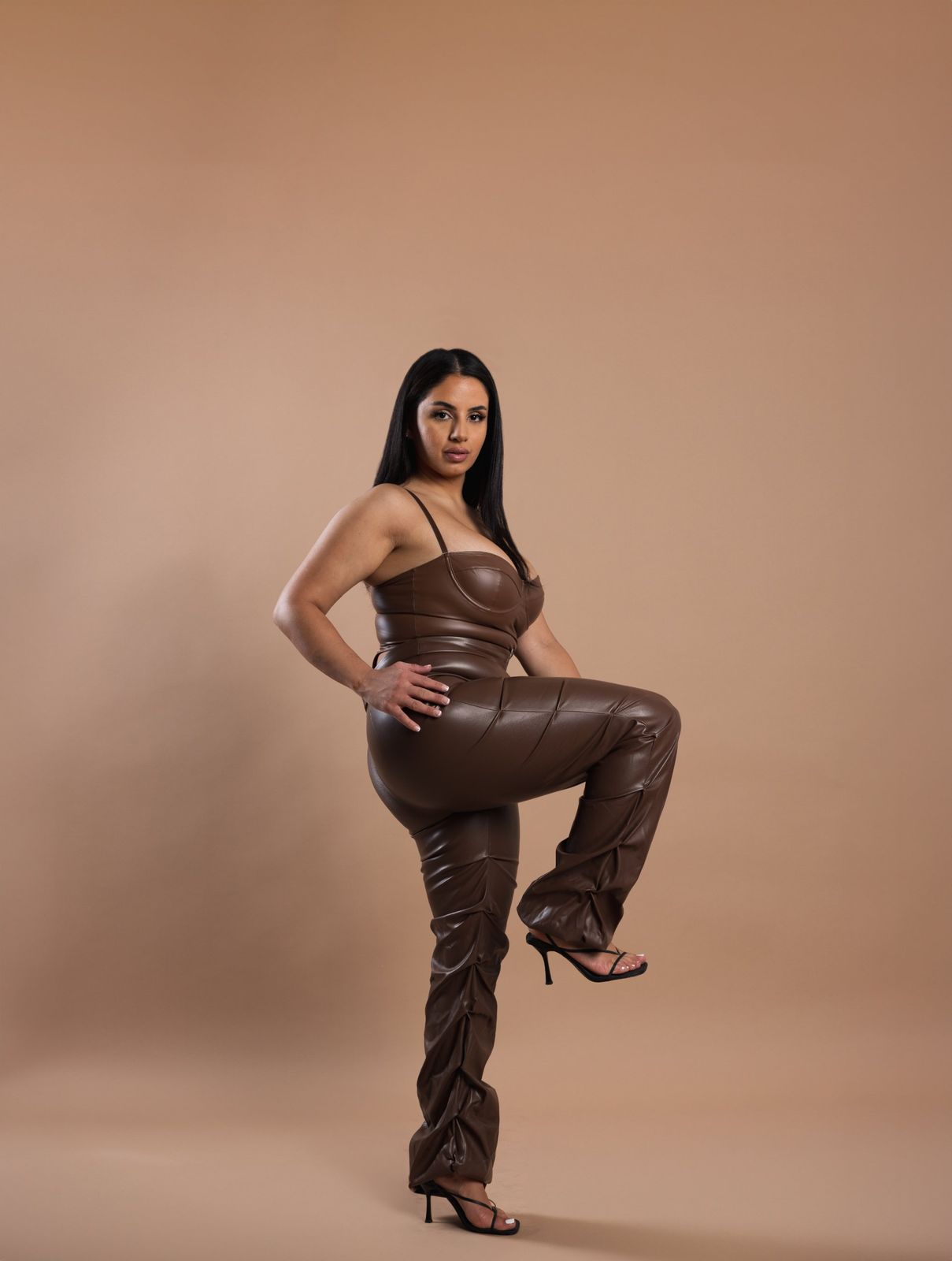 Editorial portrait in a brown leather set