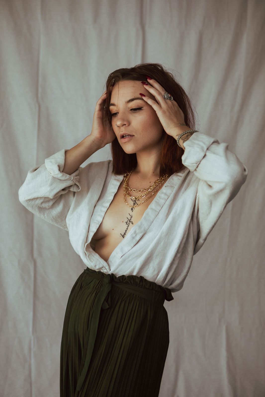 Lifestyle portrait in linen against a draped backdrop